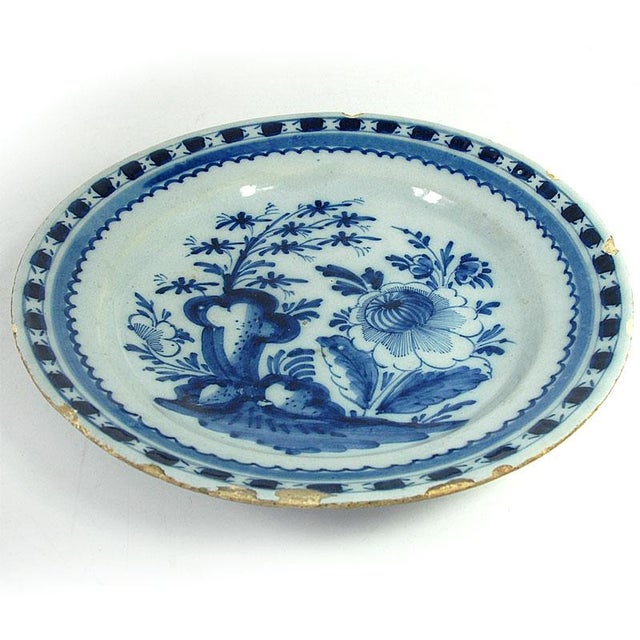A unique, large, and highly decorative plate. Made of hand-painted faience, it comes from the Dutch Delft factory in the...