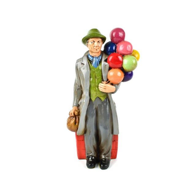 Unique old man and woman balloons and flowers seller. It is a great set to enhance any home. They are in great vintage...