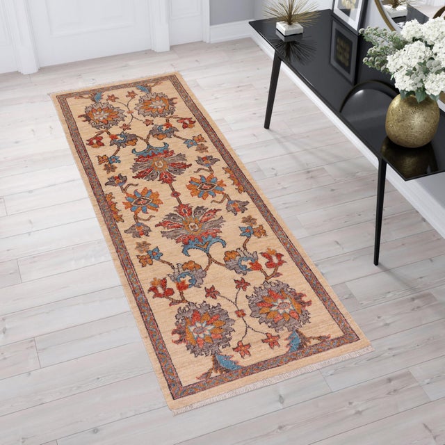 Enhance the ambiance of your home with this magnificent Persian-influenced Turkish hand-knotted rug made by skilled...