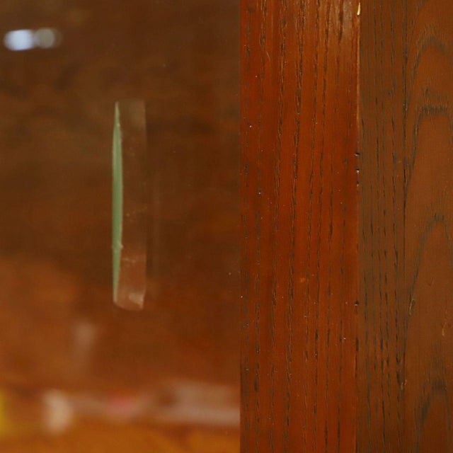 Beautiful antique two-piece store cabinet featuring a large sliding-glass display top over a step-back counter and lower...