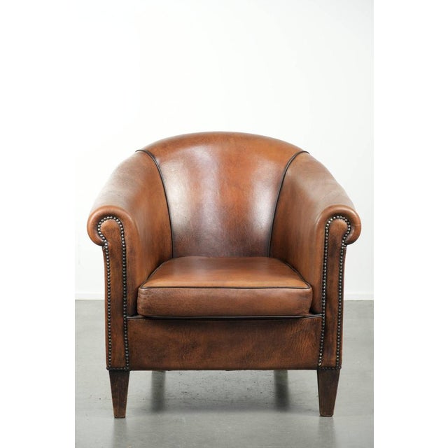 Offered by ByThijs: this characterful and comfortable sheepskin club armchair with a beautiful patina and a refined finish...