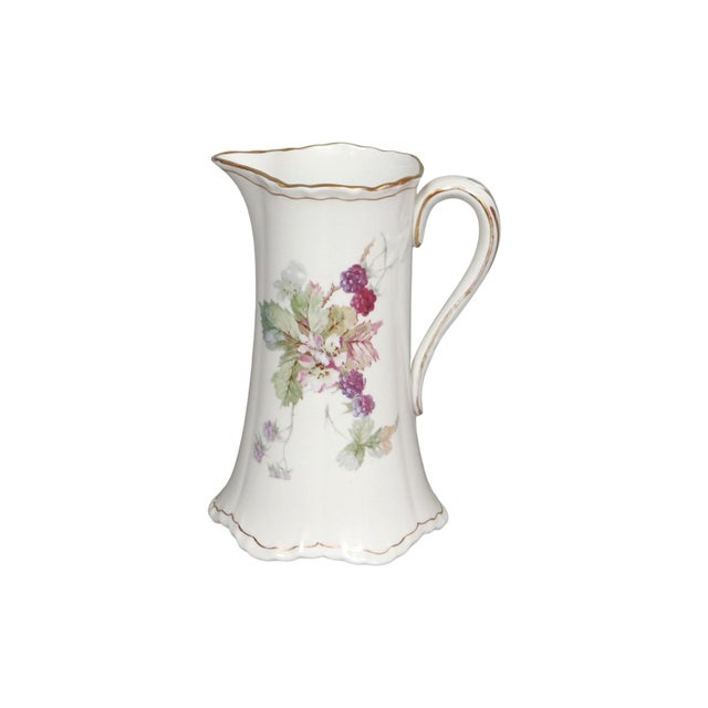 An antique ceramic pitcher made by Sevres China Company of East Liverpool, Ohio, circa 1900. Decorated with a delicate...