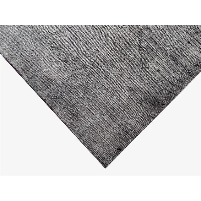 Beautiful hand knotted modern and fashionable collection of borderless designs rug, made of 75% wool and 25% cotton in...