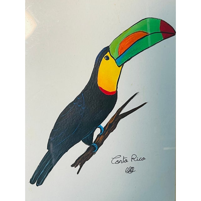 Vintage Costa Rican watercolor on paper of a Toucan bird. Signed and framed in gold tone frame.