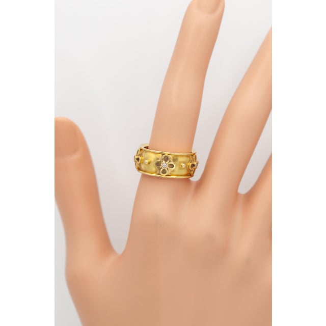 This elegant wide band ring by Temple St. Clair is handcrafted in rich 18K yellow gold. The design features signature...