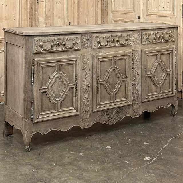 18th Century Country French Louis XIII Buffet in Stripped Oak is a masterpiece of craftsmanship where the artisans used...