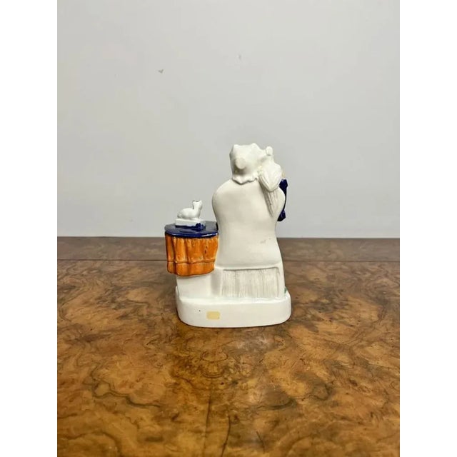 Antique Victorian Staffordshire group having a antique Victorian Staffordshire group with a seated lady with a bird on her...