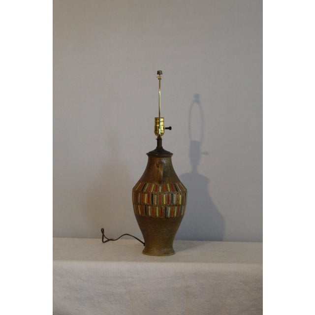 Bitossi influence table lamp. Etched graphic design that's hand glazed vibrant colors on a back round of olive green....