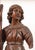 An impressive pair of Italian carved wooden angel candelabra or torchères, dating to the late 16th to early 17th century....