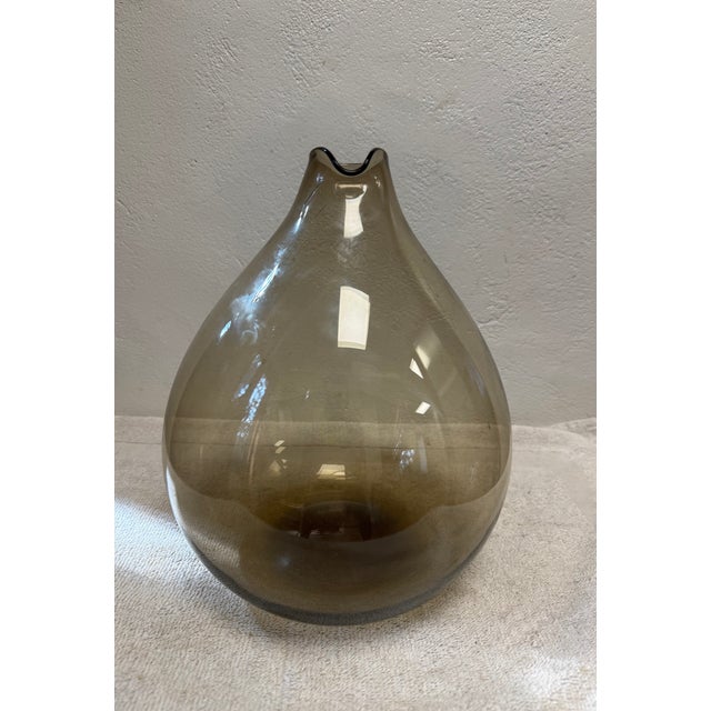 Large “Blomkulla” bulbous amber colored glass carafe designed by Kjell Bloomberg for Gullaskuf, Sweden. There is no makers...