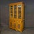 A wonderful golden oak bookcase with beautiful leaded windows to the upper doors which sit below a very crisp dentil...