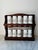 This vintage wooden spice rack with 12 milk glass spice jars is a charming addition to any farmhouse-style kitchen. Made...