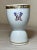 This exquisite Samson egg cup is a lovely 19th century example, featuring a beautifully hand-painted monogram on a white...