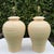 Vintage ribbed ceramic table lamps with sculptural rounded forms and a hand-painted finish in warm cream, beige, and...