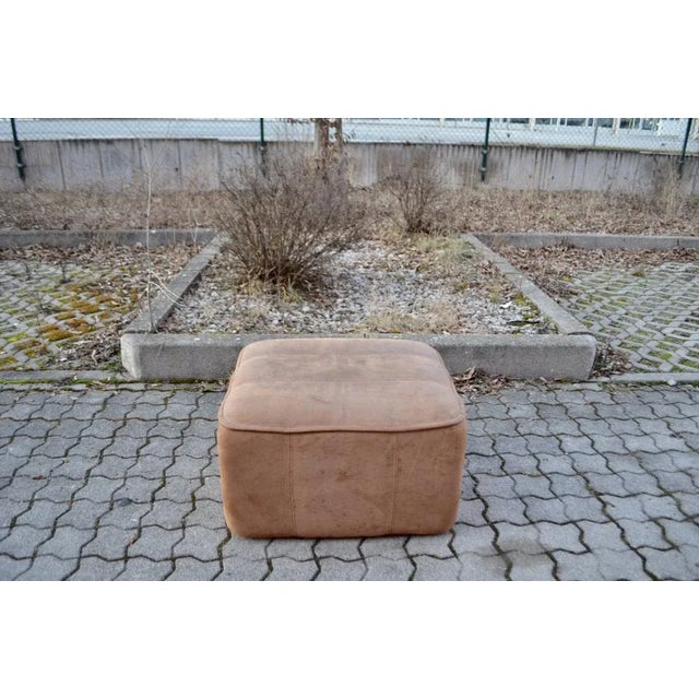 This DS-44 Ottoman was manufactured by De Sede. It features an extremely thick leather upholstery. The seat padding is in...