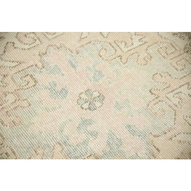 Introducing a one-of-a-kind vintage Turkish hand-knotted wool rug, carefully crafted by skilled artisans using traditional...