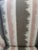 Beautiful and classic walnut wing chair reupholstered in modern pink, gray and taupe, brown and white striped graphic...