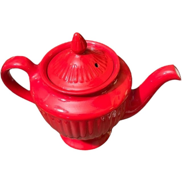 This vintage Hall pottery teapot in a stunning red color is a must-have for any collector of decorative cookware. Crafted...