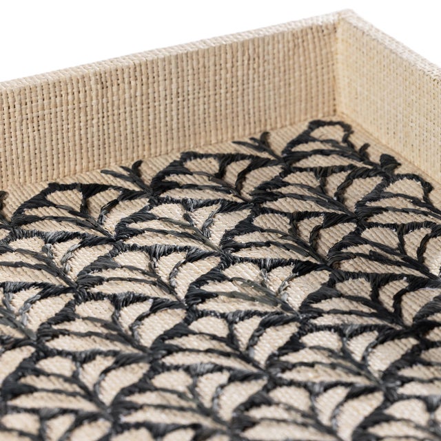 A stunning blend of natural materials and artisanal craftsmanship, this serving tray is crafted from chipboard wrapped in...