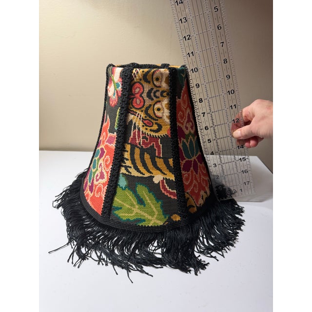 A richly patterned designer lampshade crafted from P. Kaufmann’s “Tiger Eye Basketweave Slate” fabric, featuring a vibrant...