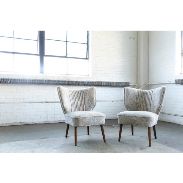 A very cool matching pair of Danish slipper or cocktail chairs from the 1950s. Very comfortable and light weight and thus...