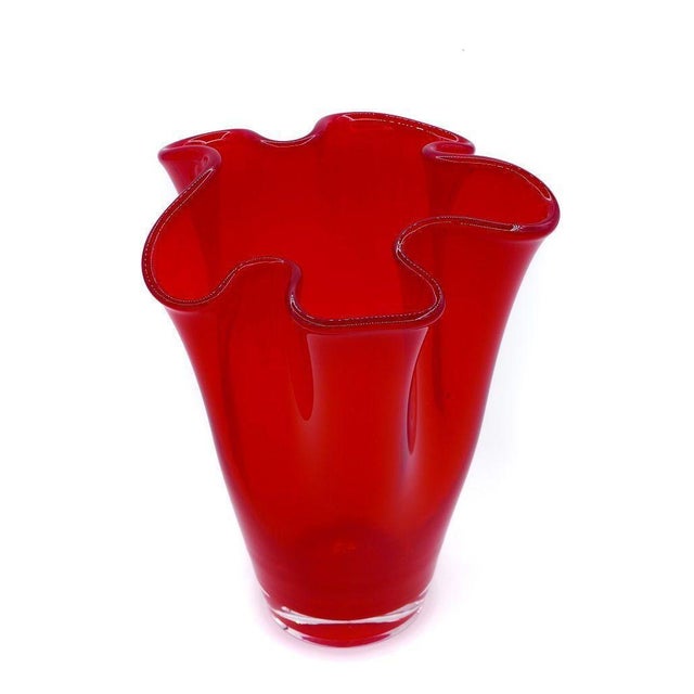This Chinese handkerchief vase is a decorative object realized in China in the 20th century. Red glass vase excellently...