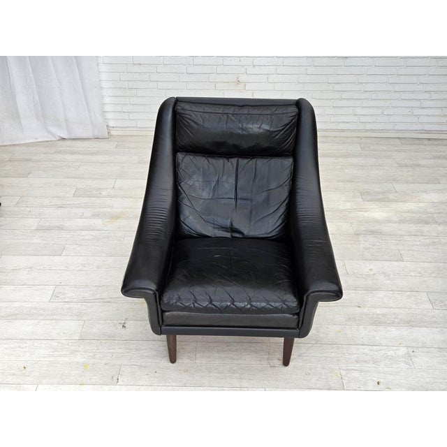 1960s, Danish highback armchair by Aage Christensen. Original black furniture leather, teak wood legs. Original good...