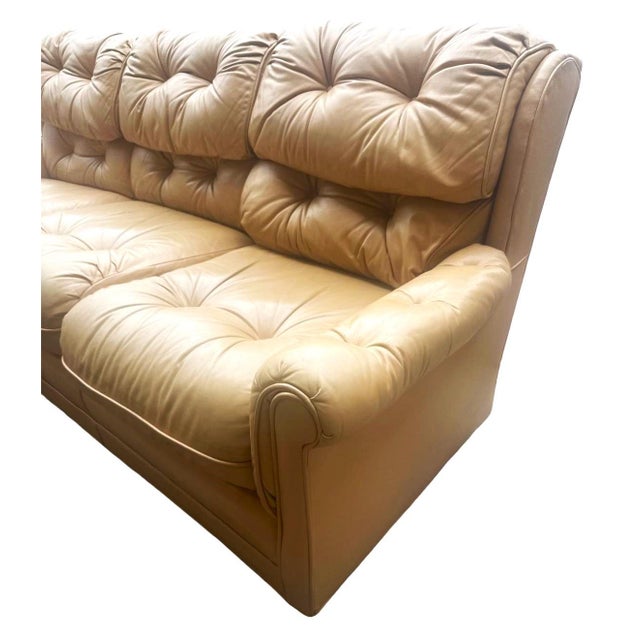 This comfortable vintage leather sofa from Hickory, North Carolina is a light tan color. We've reconditioned the leather,...