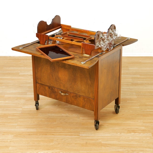 Vintage burr walnut liquor cabinet / drinks trolley on castors, showcasing richly figured veneer and a compact, highly...