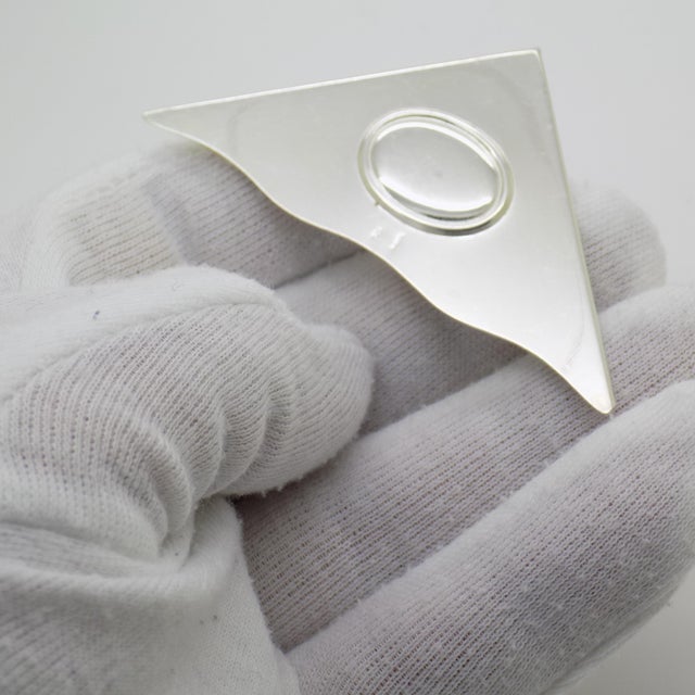 A decorative bookmark, handcrafted in continental silver (800/000) in italy during the 1980s and 1990s, reflecting the...