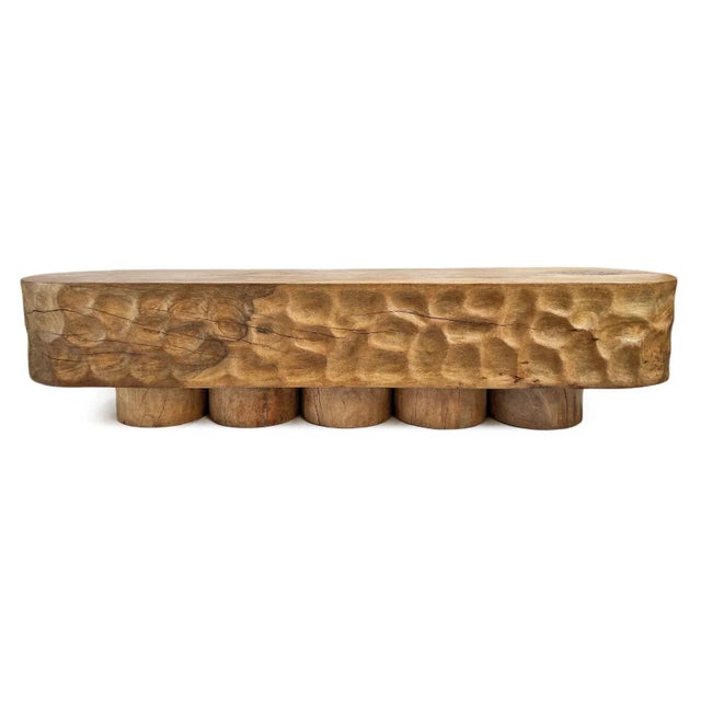 Solid vintage monkey pod wood bench with unique hand carved concave dimple texture around sides. Rounded edges and five...