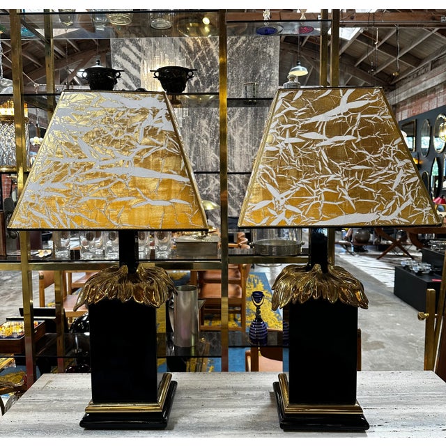 Extraordinary pair of 2 art deco Italian Table lamps made in Italy 1980s the lamps are in black with a brass metal on the...