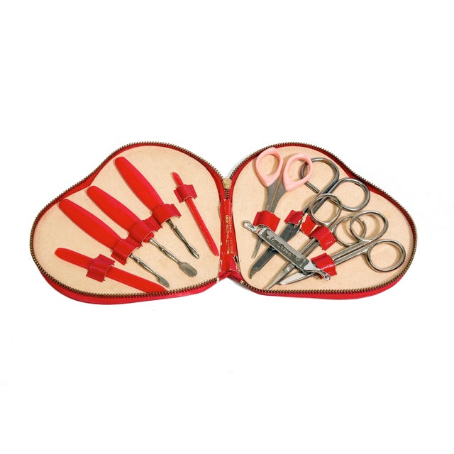 This is such a glamorous little piece of mid-century beauty history—a red leather, heart-shaped manicure case that feels...