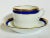 Richard Ginori flat cups with deep saucers in the Palermo Blue pattern. This set includes 12 cups and 11 saucers. Makers...