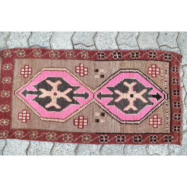 This is a vintage Turkish Oushak rug from the 1960s. The piece was hand-knotted.