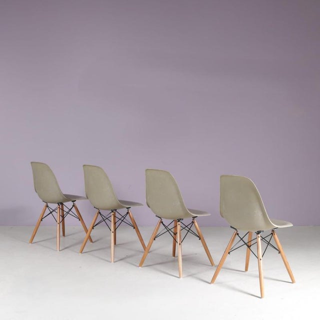 1960s set of 4 dining chairs in “sea foam” green fiberglass, designed by Charles & Ray Eames for Herman Miller, USA. An...