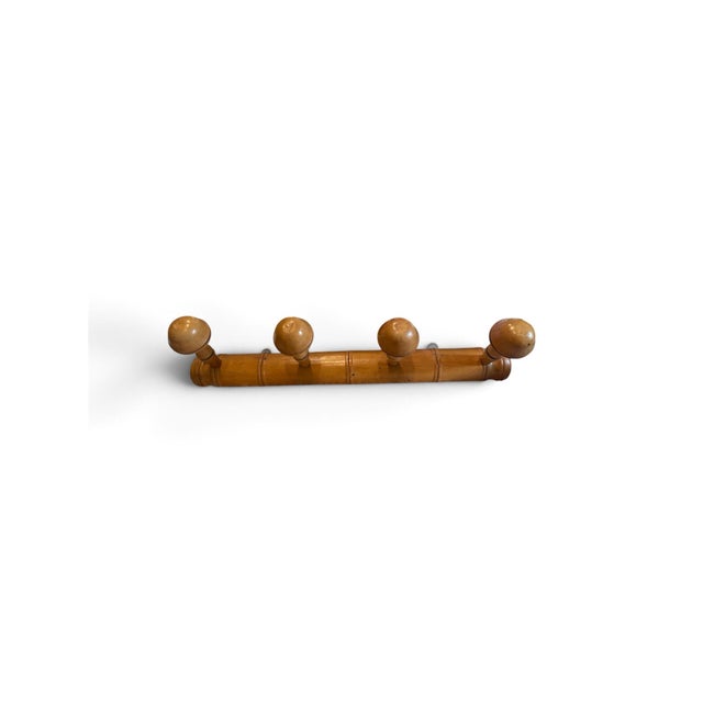Add a touch of effortless French Provincial charm to your home with this vintage four-peg "faux bamboo" wall-mounted coat...