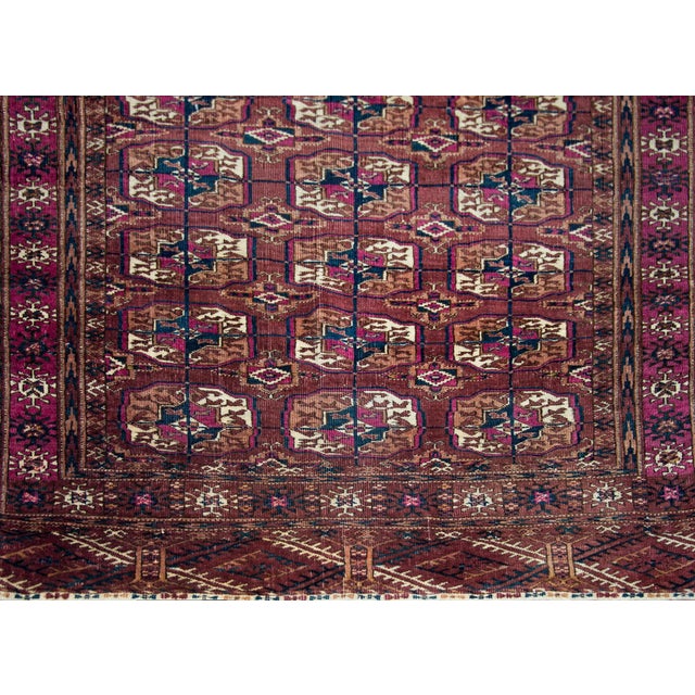 A beautiful early 20th century Persian Tech rug with an all-over pattern with myriad medallions with stylized flowers and...