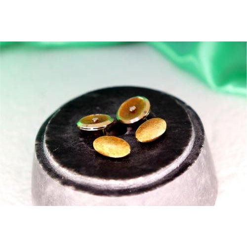 Two-tone gold cufflinks in button shape with brilliant-cut diamonds in the center. Metal: Gold. Origin: Italian. Brand:...