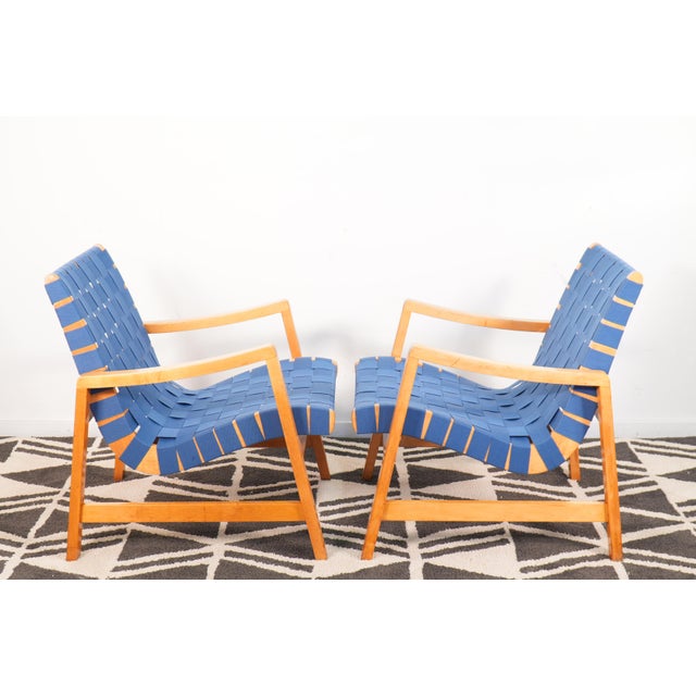 Recently re-strapped with original style 2" cotton webbing in steel blue. One chair retains its original "Knoll Associates...