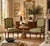 Elegant pair of vintage 1970s French Louis XVI-style armchairs featuring beautifully carved walnut frames with intricate...