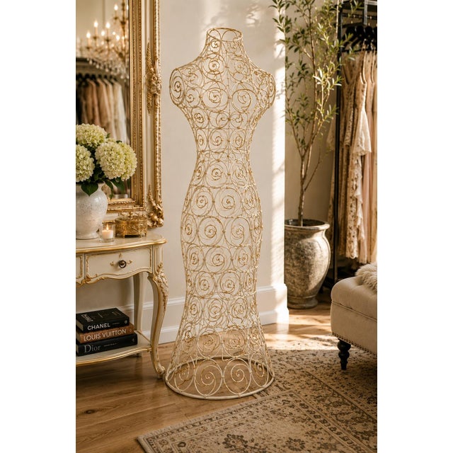 Elegant and sculptural, this oversized wire dress form brings romantic boutique charm to any interior. Finished in warm...