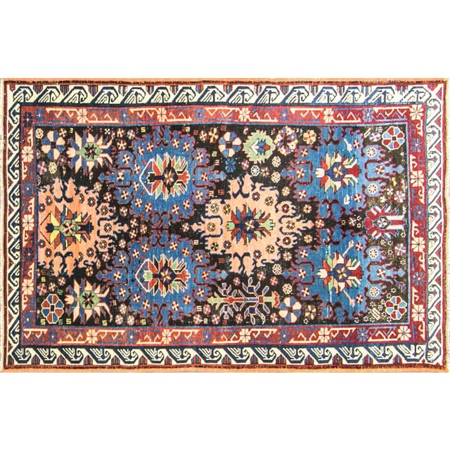 This is a particularly lively and unusual example. The field is organized around large, strongly drawn geometric floral...