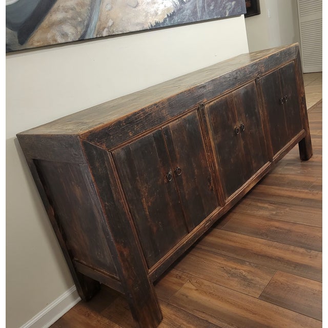 Stunning antique Chinese 4-door sideboard crafted from solid Elm wood This statement piece features a gorgeous, authentic...