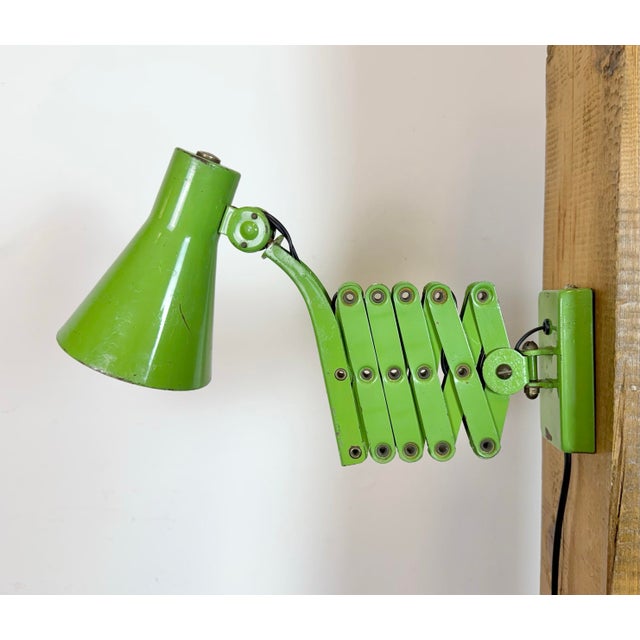 This vintage industrial workshop scissor wall light was made by Kaiser Leuchten in Germany during the 1960s. It features...