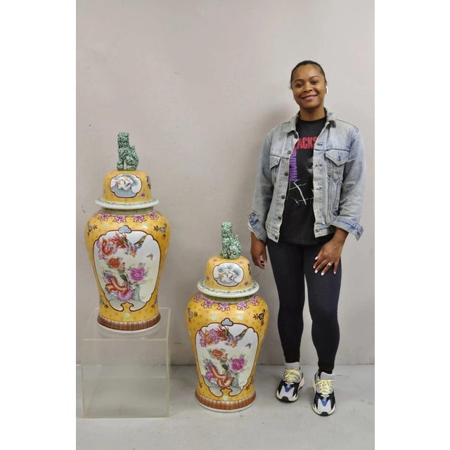Vintage Chinese Porcelain Large Foo Dog Covered Temple Urns Ginger Jars - a Pair. Urns feature bird, butterfly, and floral...