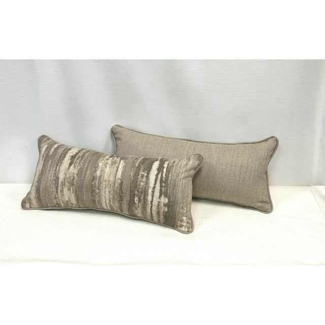 11” x 24” lumbar pillow cover in Clarke & Clarke’s Latour fabric, color Taupe (front). It has grey, cream and light gold...