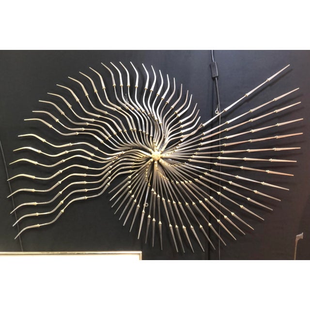 Simply amazing vintage Ron Schmidt wall MCM sculpture. Made from nails and fashioned in a radiating spiral pattern. Signed.