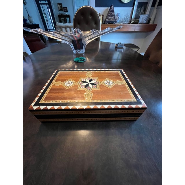 This handcrafted Italian folding chess game box showcases the celebrated marquetry traditions of Sorrento. Executed in...