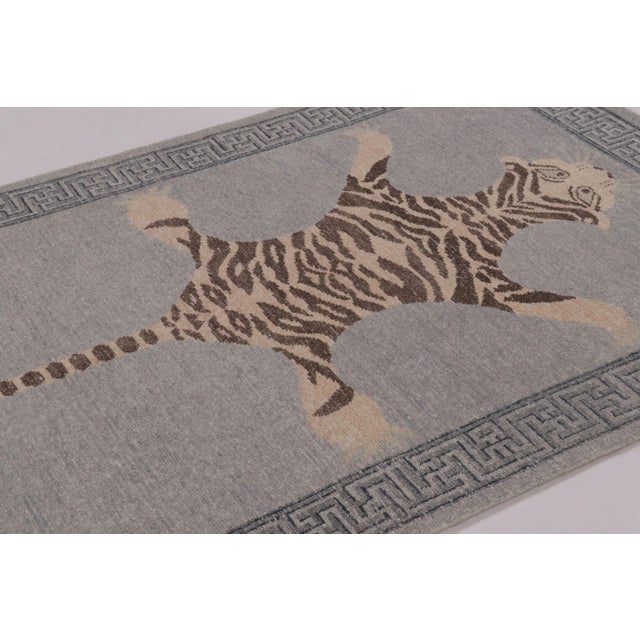 Hand-knotted in wool, this 5x7 rug is a striking new addition to our Distressed Homage collection, inspired by a mid-...